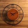 7d4e5c42-6da8-4404-bb82-2e61d8c0c542.jpg CLOCK IRON WITH CENTER WOOD OPEN DAIL